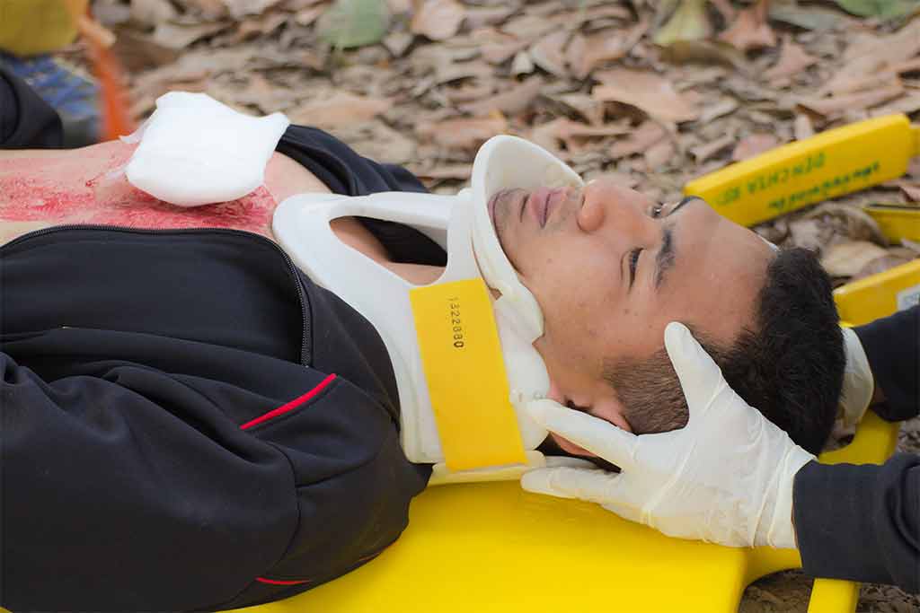Man lying on stretcher with neck collar