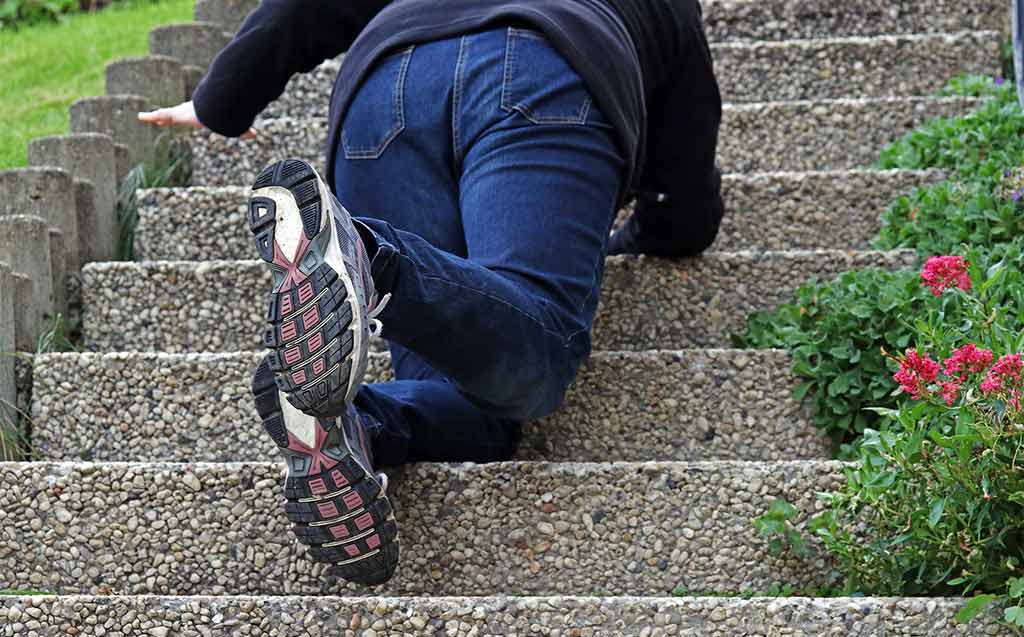 woman falling down steps